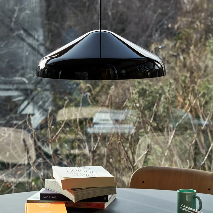 The Pao Steel pendant lamp, Ø 47 x H 16.25 cm, black by HAY over a round table in front of the window