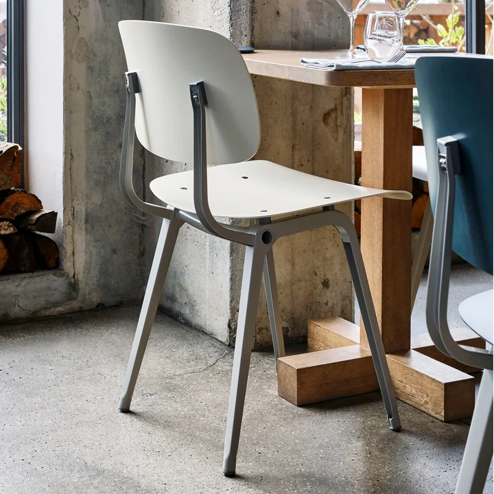 The Revolt Chair, beige / beige by HAY on a small wooden table