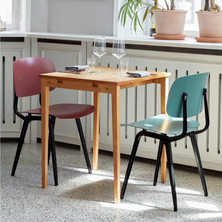 The Revolt Chair by HAY at a table for two