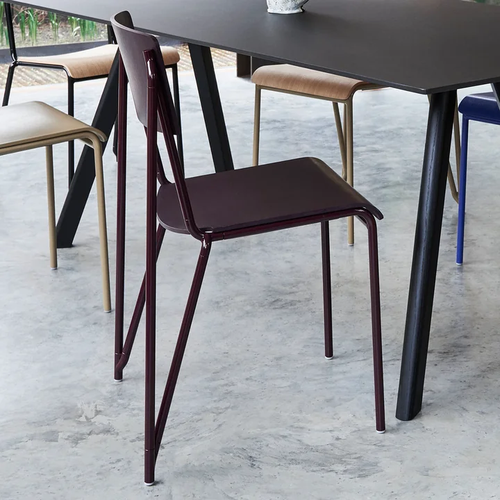 The Petit Standard chair, dark bordeaux / dark bordeaux by HAY on a black table
