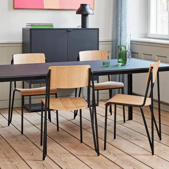 The Petit Standard chair, black / oak matt lacquered by HAY in the dining room with lots of wooden elements