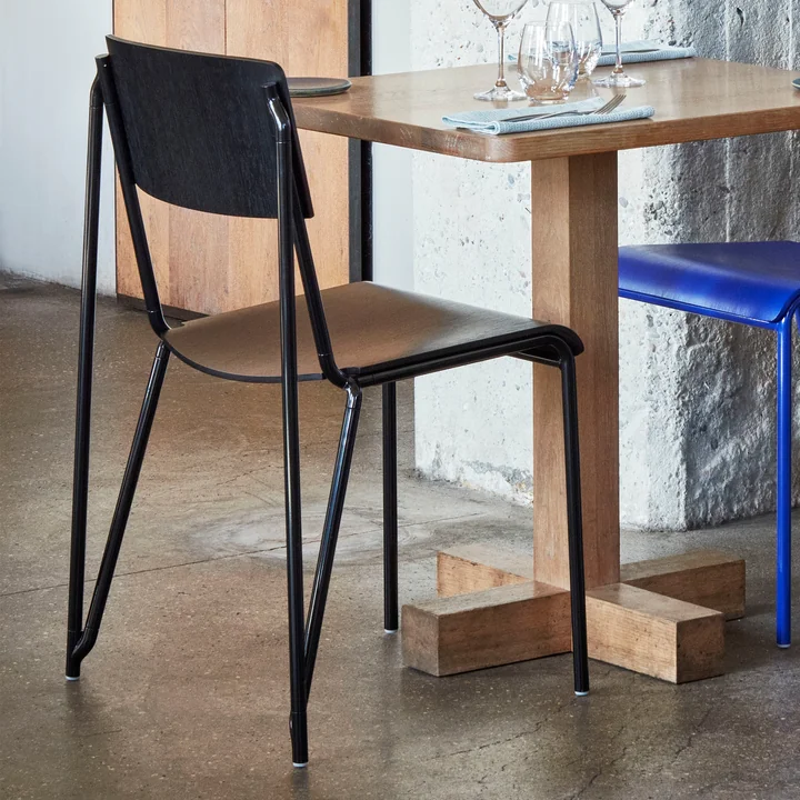 The Petit Standard chair, black / black by HAY on a table for two