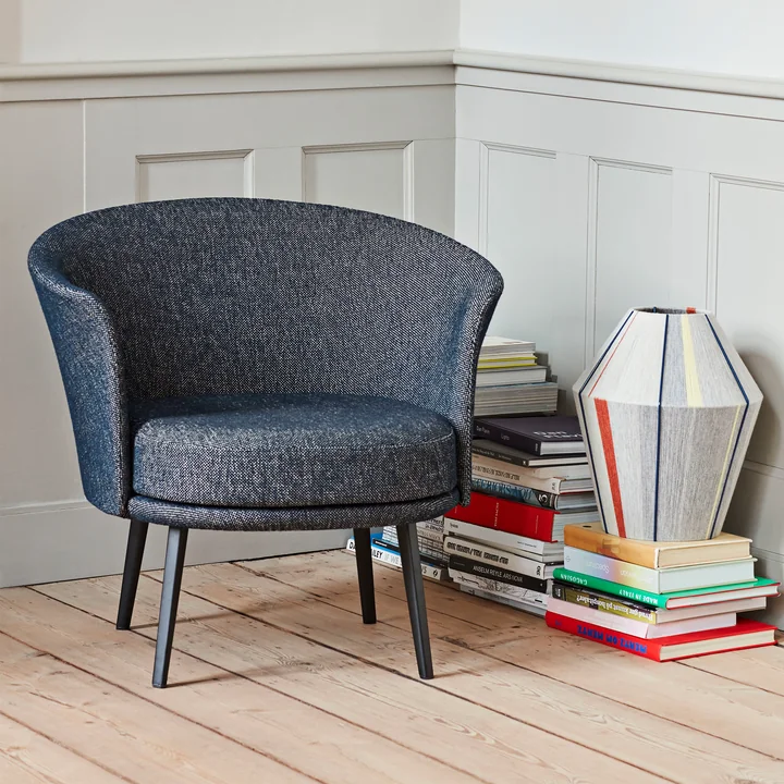 The Dorso armchair, powder-coated steel, fairway dark blue (308-288) by HAY in a reading corner