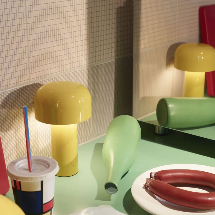 The Bellhop LED table lamp from Flos on the retro dining table