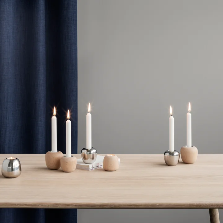 The Ora candlesticks of Stelton in their different versions on the dining table