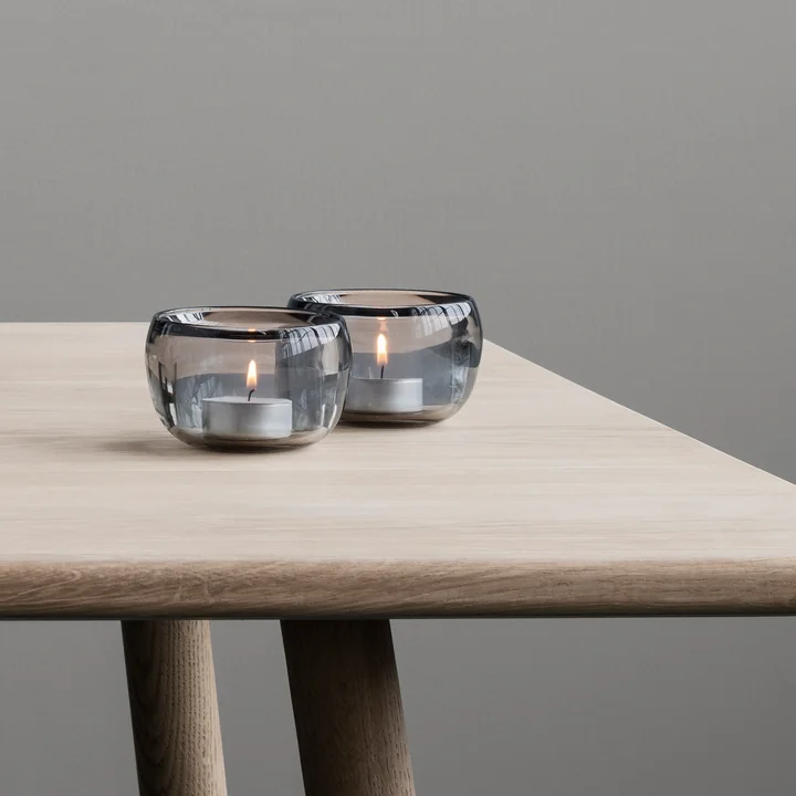 The tealight Ora holders from Stelton on the dining table