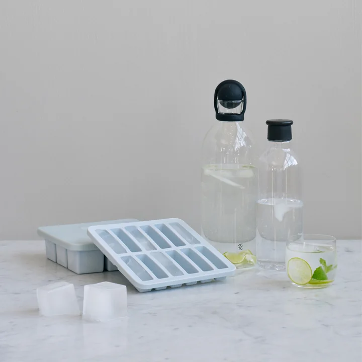 The Freeze-It ice cube maker with lid from Rig-Tig by Stelton with glass carafes on the table