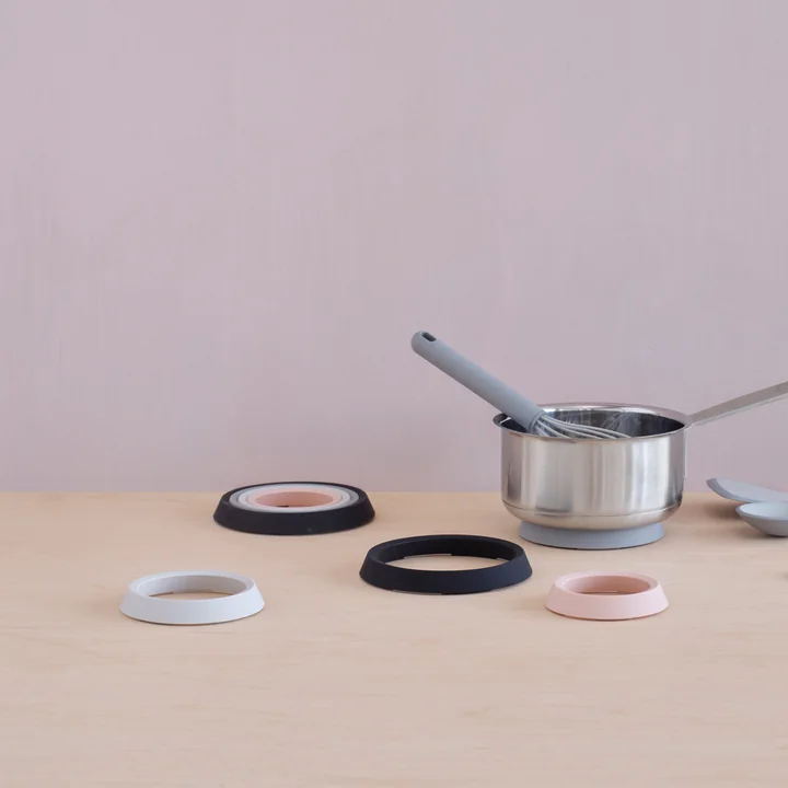 The Place-It coasters from Rig-Tig by Stelton with a cooking pot on the table