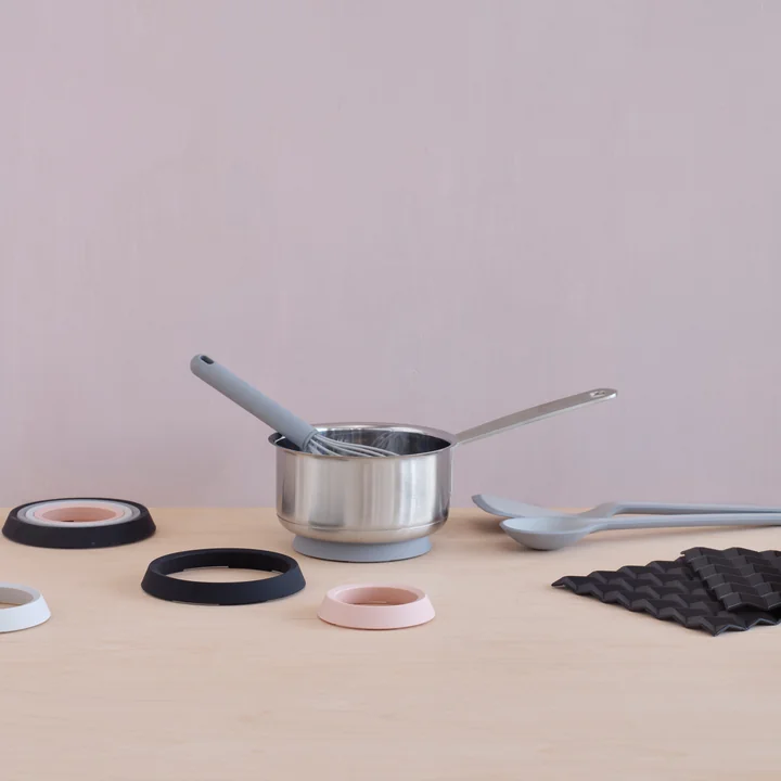 The Cook-It kitchen helpers from Rig-Tig by Stelton with a cooking pot on the table
