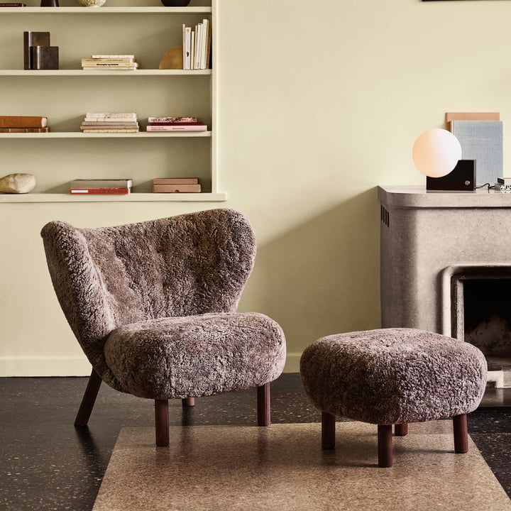 The Pouf ATD1 in the colour Sheep Sahara next to the Little Petra Lounge Chair by & tradition in the living room