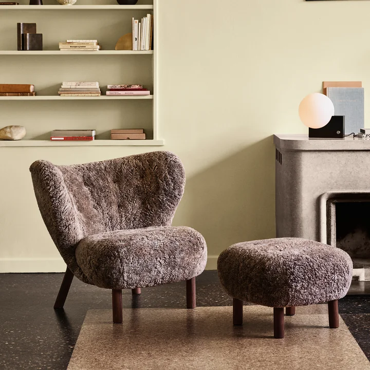 The Pouf ATD1 in the colour Sheep Sahara next to the Little Petra Lounge Chair by & tradition in the living room