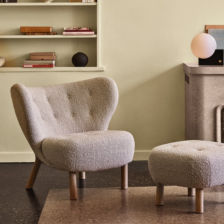 The Pouf ATD1 next to the Little Petra Lounge Chair by & tradition in the living room