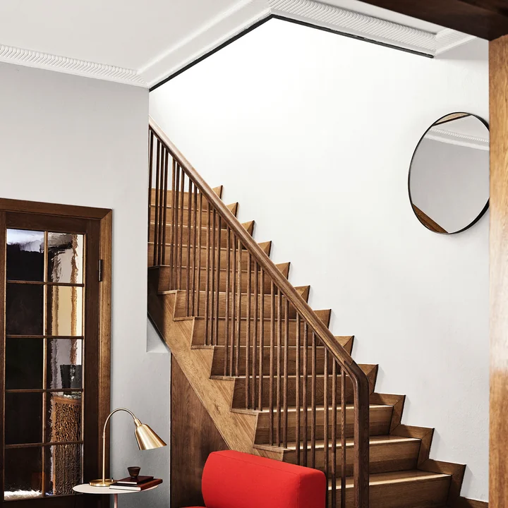 The Amore mirror SC56 from & tradition in the hall above the stairs