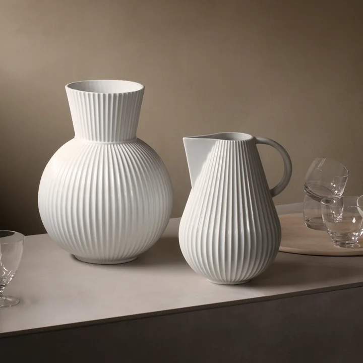 The Lyngby Tura Jug vase next to the Tura vase, white from Lyngby Porcelæn on the table