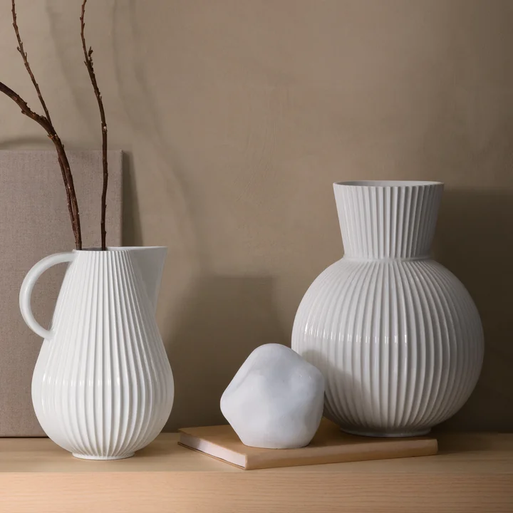 The Lyngby Tura Jug vase and the Tura vase, white from Lyngby Porcelæn among other decorative objects