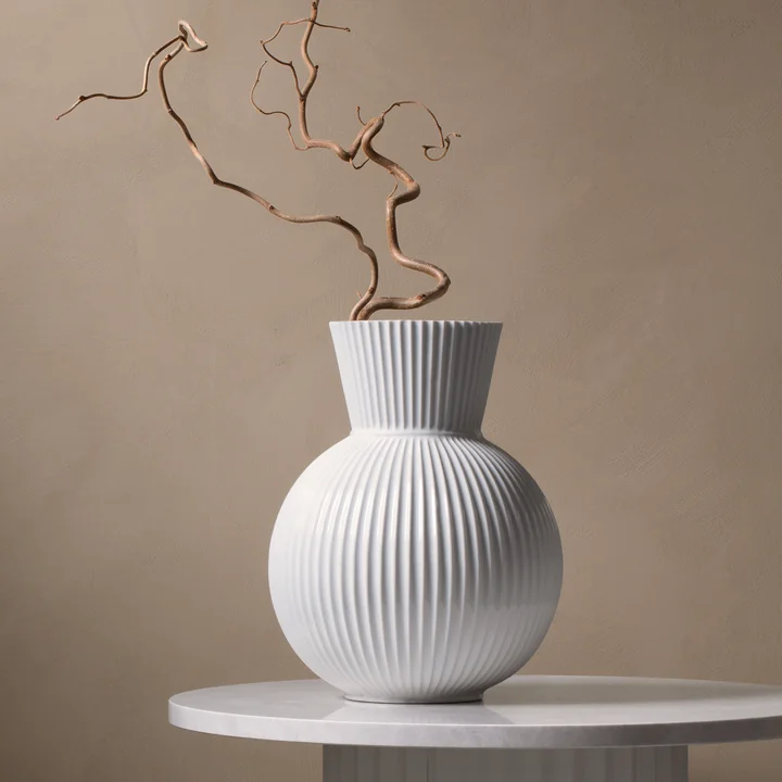 The Lyngby Tura vase, H 34 cm, white from Lyngby Porcelæn on a stone side table