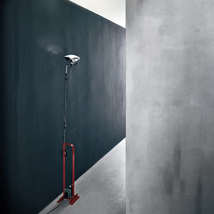 The Toio ceiling spotlight by Flos in a dark corridor