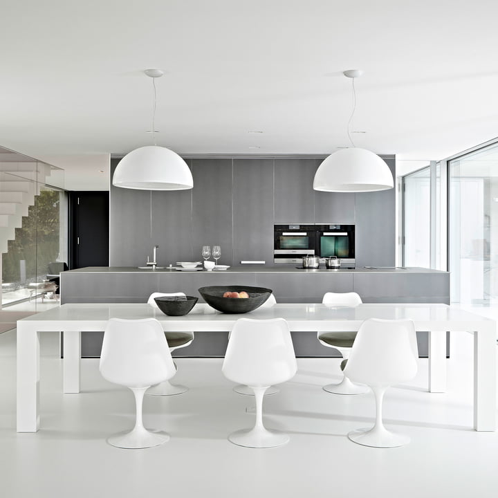 The Skygarden Pendant light from Flos above the dining table in the modern kitchen