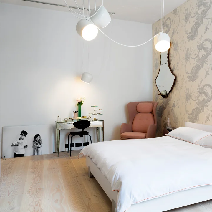 The AIM LED pendant light from Flos in the bedroom above the bed and the dressing table.