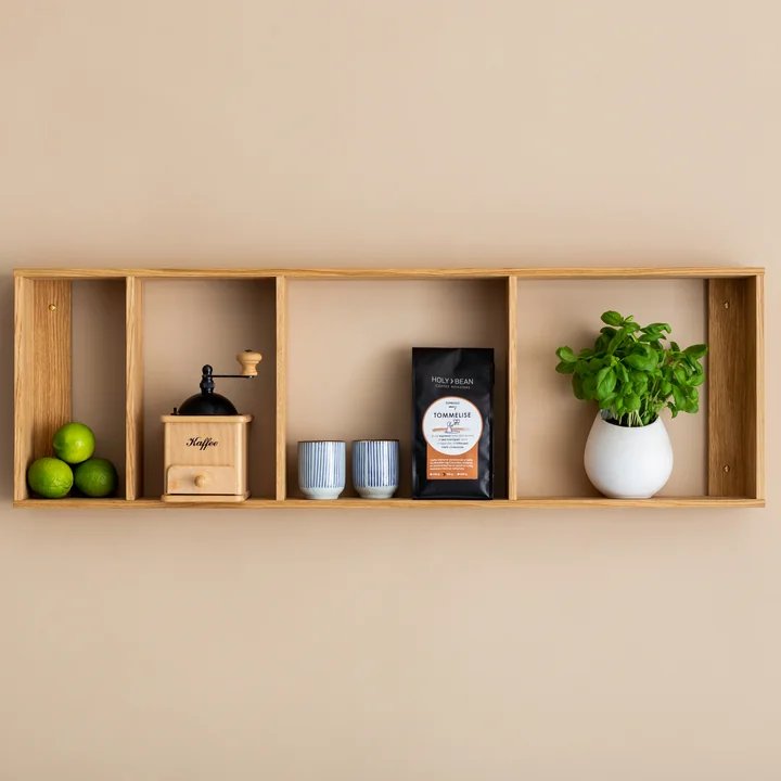 The Foursquare wall shelf from We Do Wood mounted horizontally on the wall as a shelf for plants, cups and more