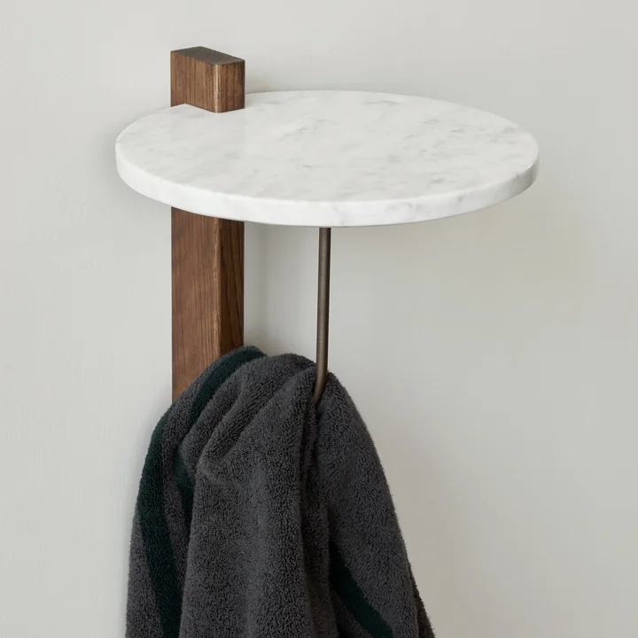 The Corbel wall shelf, dark oak / marble from Audo as a towel rail