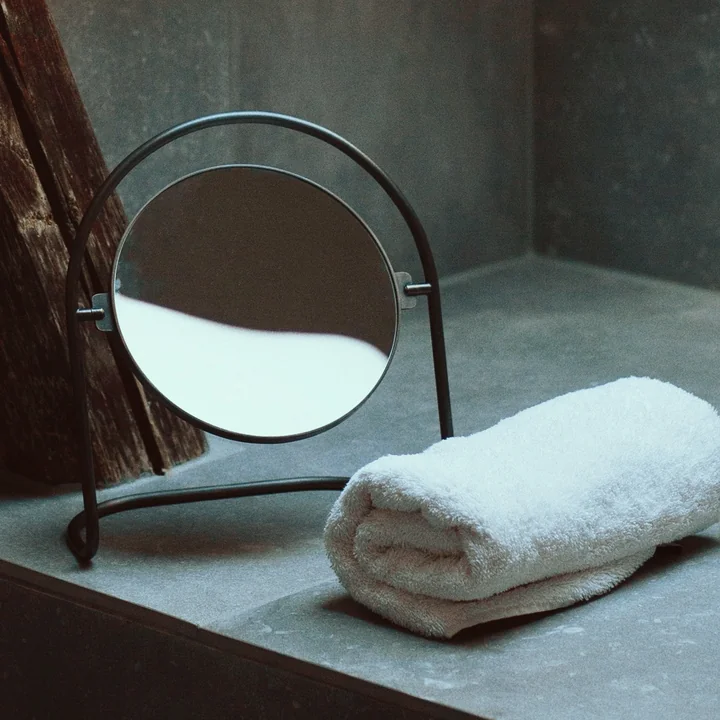 The Nimbus table mirror, brass bronze from Audo in the bathroom