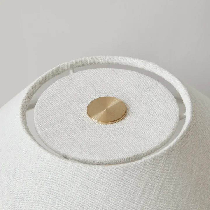 The Torso table lamp, sand / off white from Audo has a dimmer switch