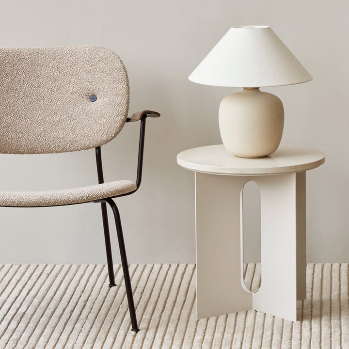 The Torso table lamp, sand / off white from Audo on a white side table