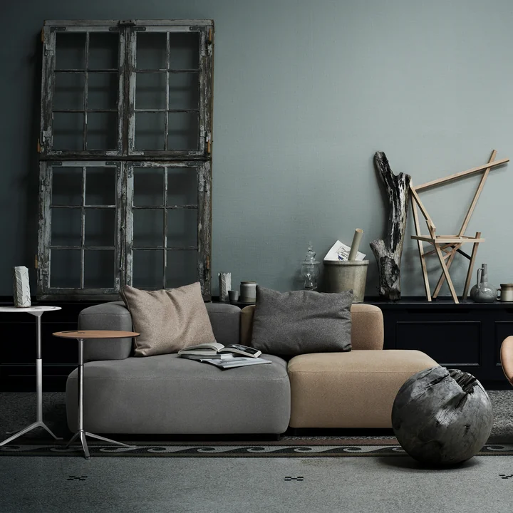 The modular Alphabet sofa from Fritz Hansen in a living area with lots of grey tones and wood elements