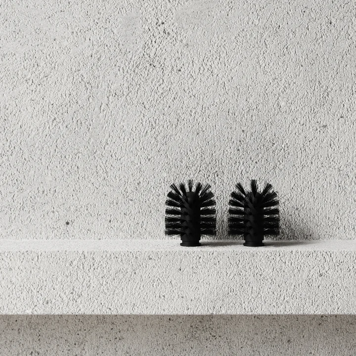The replacement brush heads from Nichba Design on a stone wall