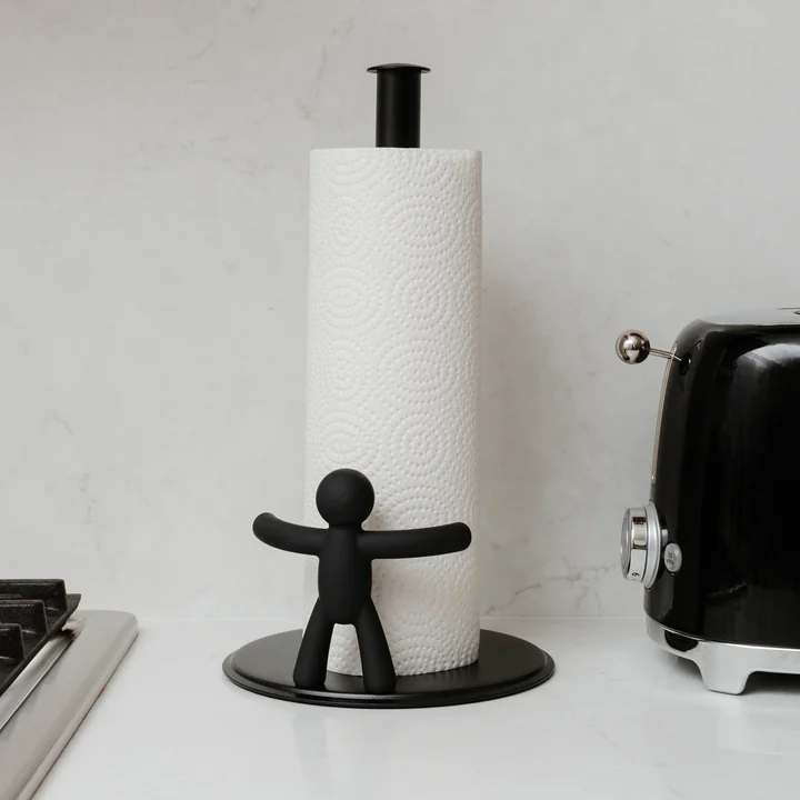 The Buddy kitchen roll holder from Umbra on the kitchen counter next to a toaster