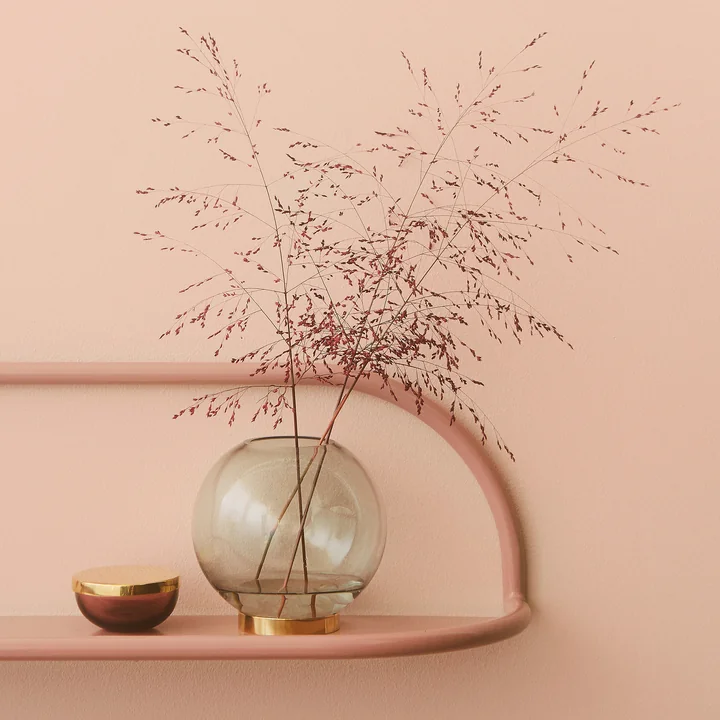 The Globe vase from AYTM on a pink wall shelf