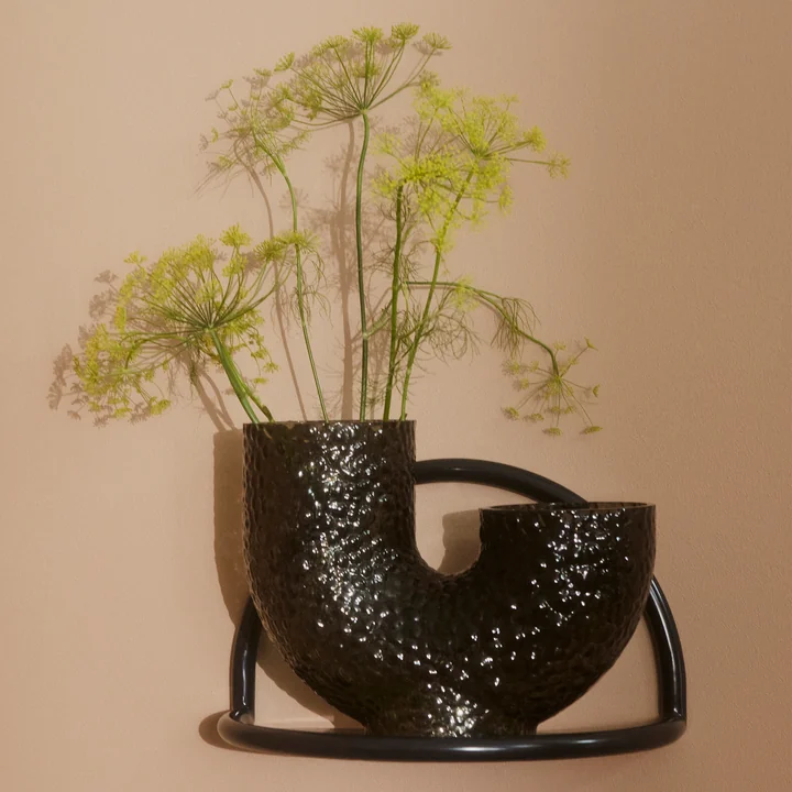 The Arura vase from AYTM on a small wall shelf