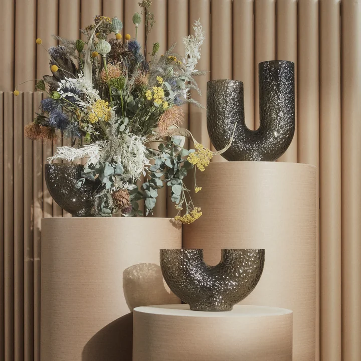 The Arura vase from AYTM in its various forms with a creative flower arrangement
