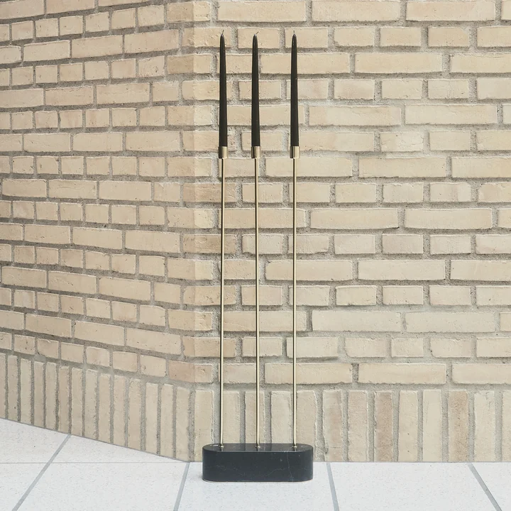 The Grasil candleholder for the floor of AYTM a stone wall
