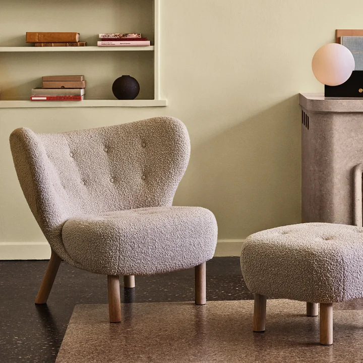 The Little Petra lounge chair with pouf from & Tradition in the living area