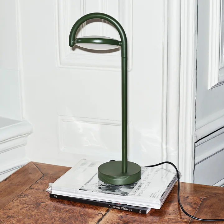 The Marselis LED table lamp from HAY on a dark wooden table
