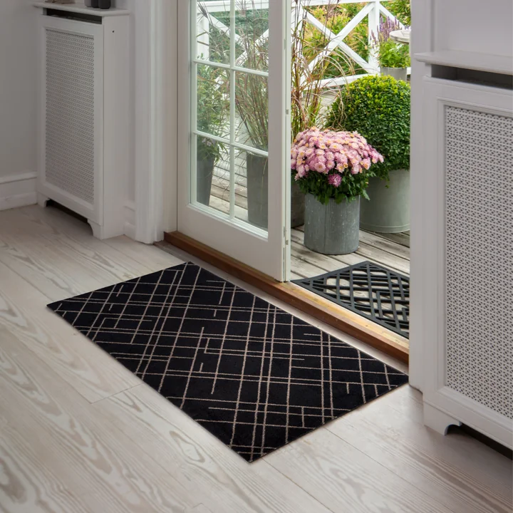 The Lines doormat from in tica copenhagen front of the terrace door