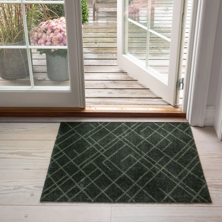 The Lines doormat from in tica copenhagen front of the door to the garden