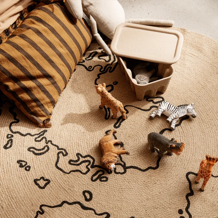 The Animal animal figures from Ferm Living on a jute carpet