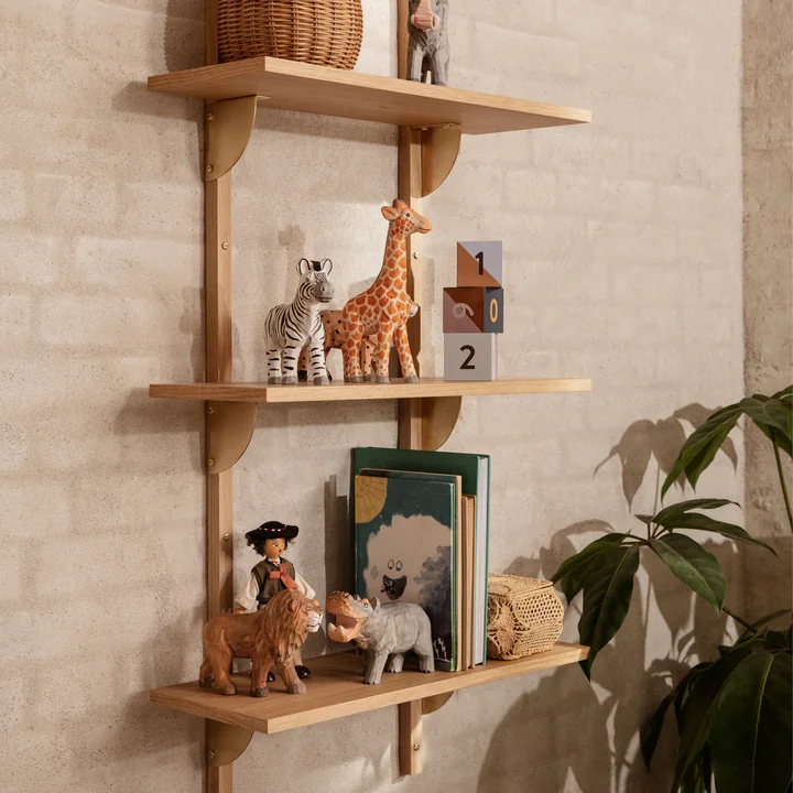 The various Animal animal figures from Ferm Living next to other toys on a wall shelf