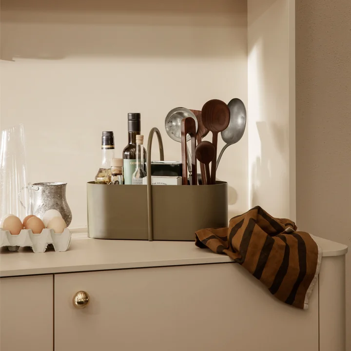 The Grib Toolbox from Ferm Living with cooking oils and cooking spoons on the kitchen counter