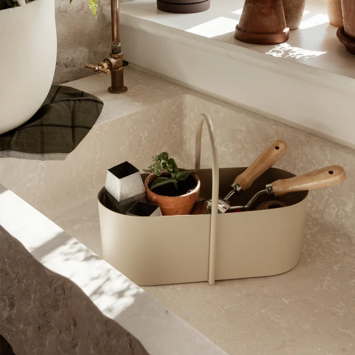The Grib Toolbox from Ferm Living with garden utensils in the noble stone sink