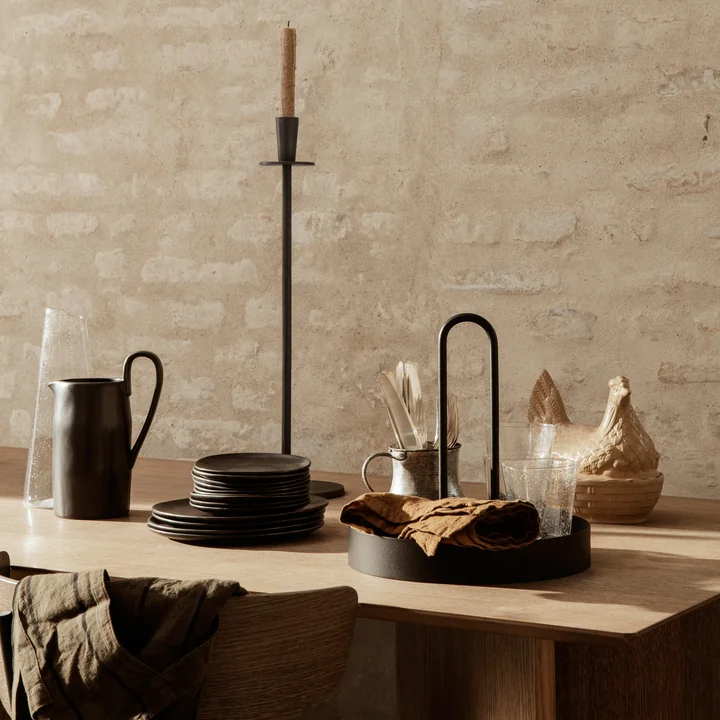 The Grib tray from Ferm Living on the laid dining table as a storage area for glasses and cloths