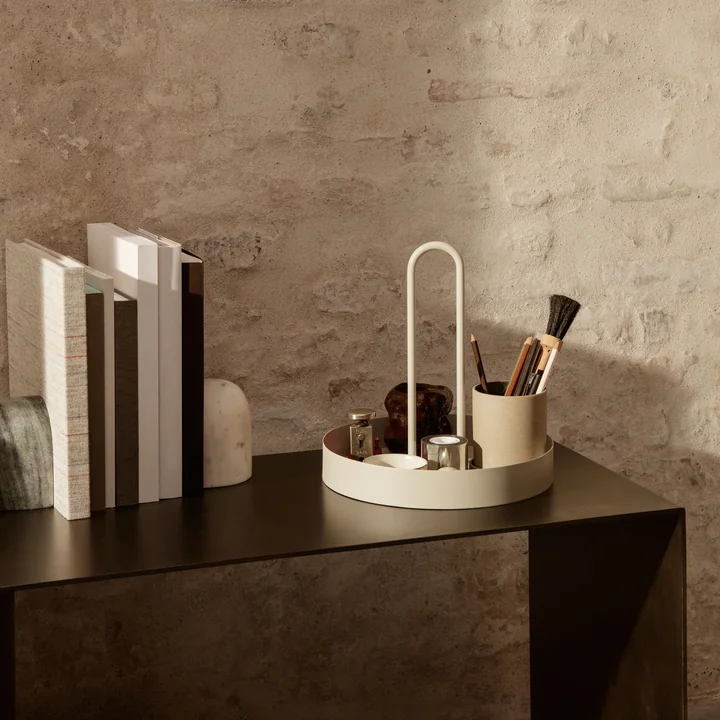 The Grib tray by Ferm Living on a metal side table with books and other decorative objects