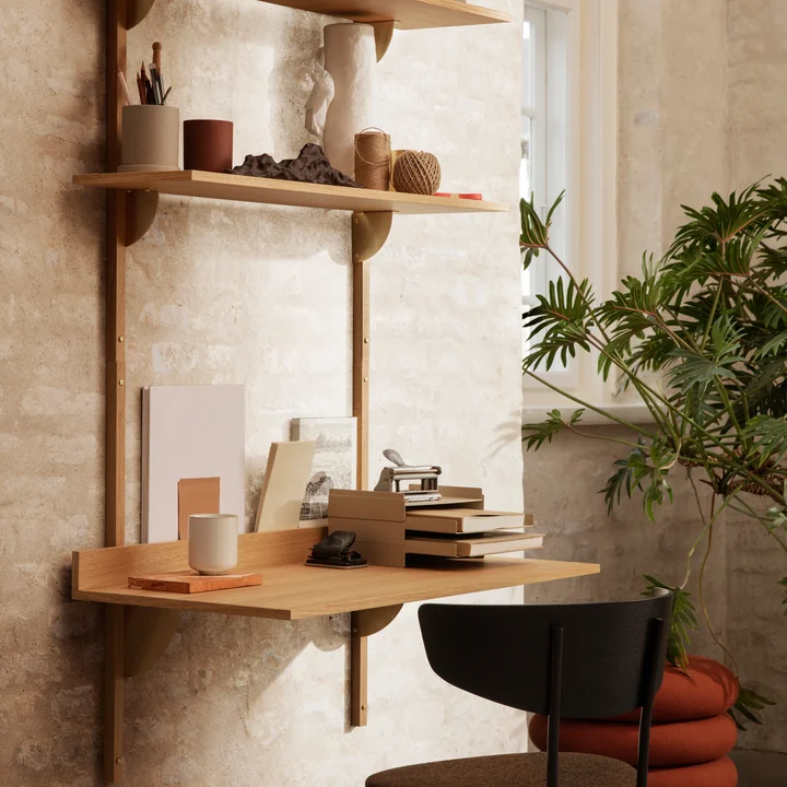The Sector desk by Ferm Living in natural oak as a work table in combination with wall shelves and a chair