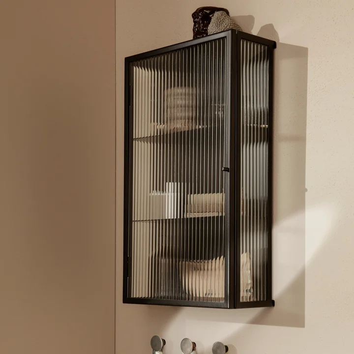 The Haze Wall Cabinet from Ferm Living on a light brown wall