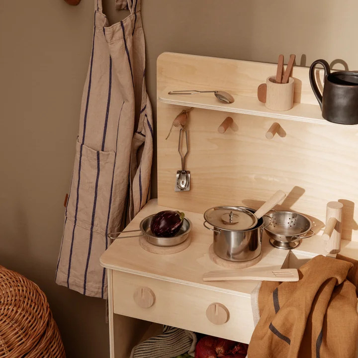 The Toro children's kitchen set from Ferm Living in a play kitchen made of wood