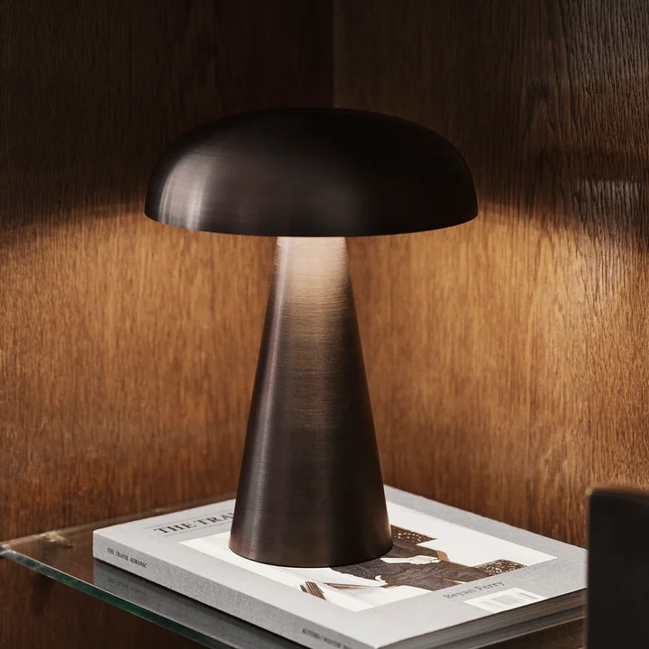 The Como SC53 rechargeable lamp from & Tradition on a glass side table