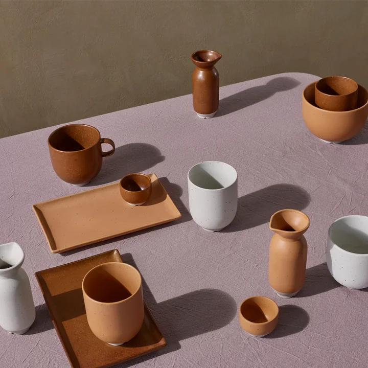 The Eli tableware from Broste Copenhagen to caramel, soft light grey matt and matt light camel